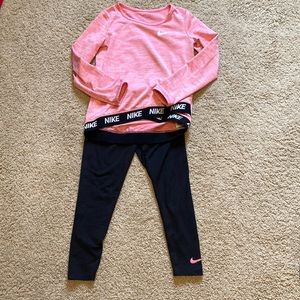 2 piece Nike outfit size 6 medium. Tiny hole at top back of pants as pictured.